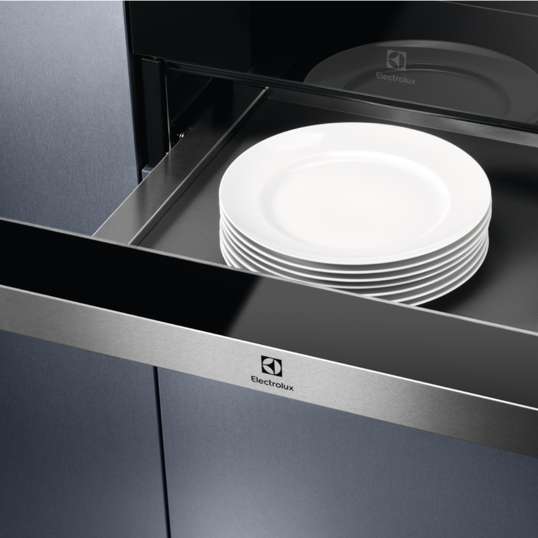Stack of white plates inside an open Electrolux 600 Series Integrated Warming Drawer Stainless Steel