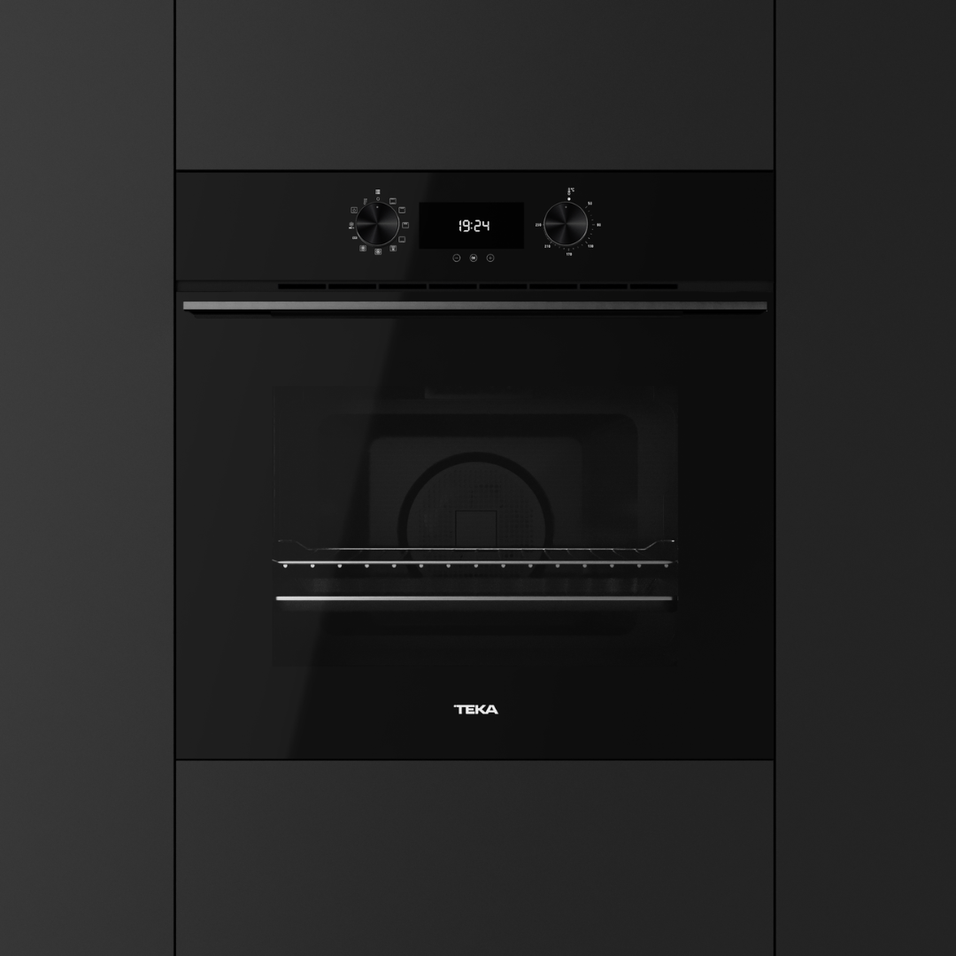 Black Teka oven on a dark gray background