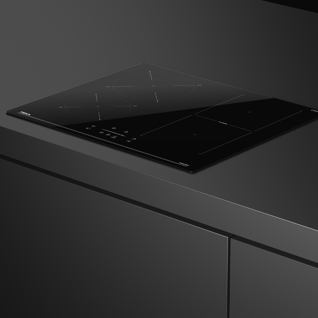 Black TEKA induction Hob on a dark gray countertop