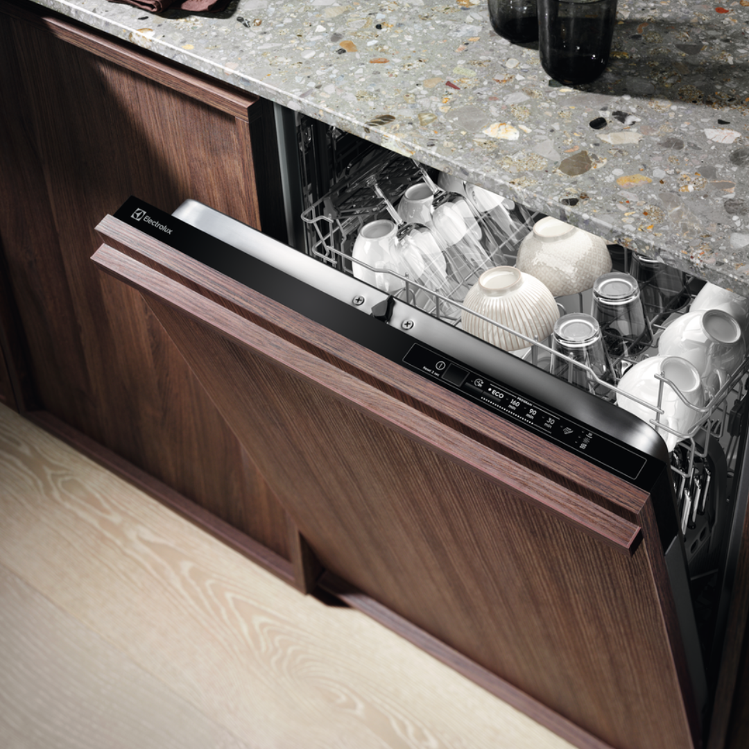Electrolux Dishwasher with open door showing clean dishes in a kitchen setting