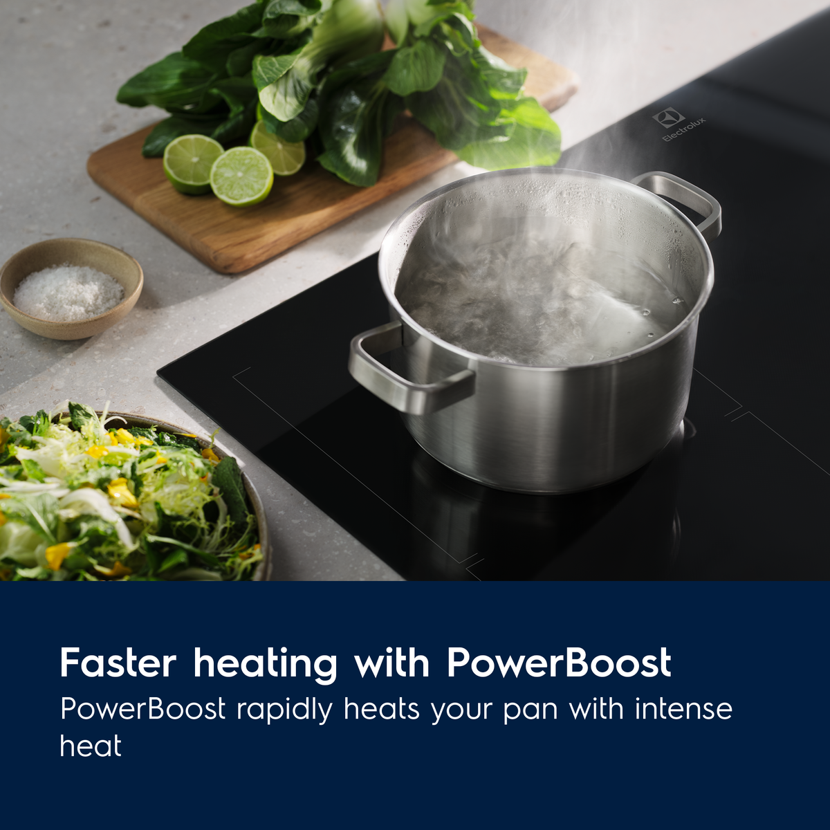 Stainless steel pot on a modern cooktop with Electrolux PowerBoost feature highlighted.
