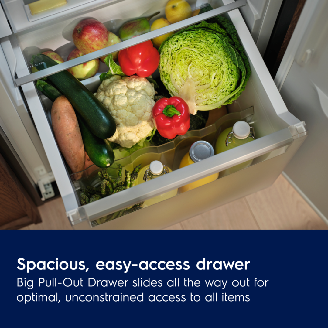 Open Electrolux refrigerator drawer filled with fruits and vegetables, with text highlighting its spaciousness.
