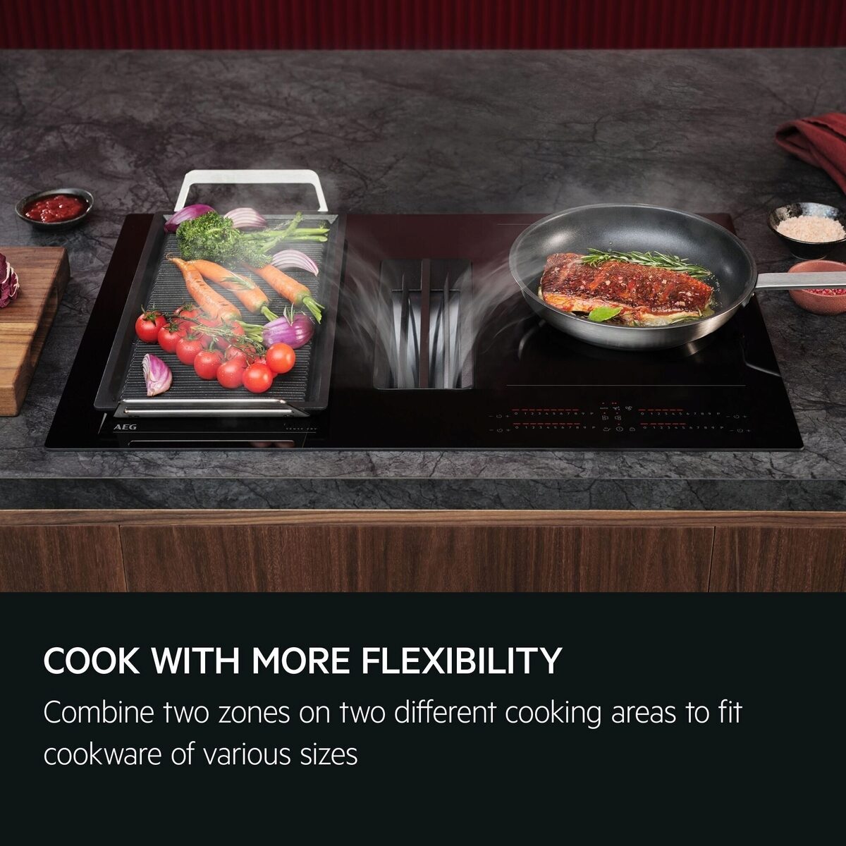 AEG Extractor Induction Hob with two zones cooking vegetables and meat on a dark countertop.