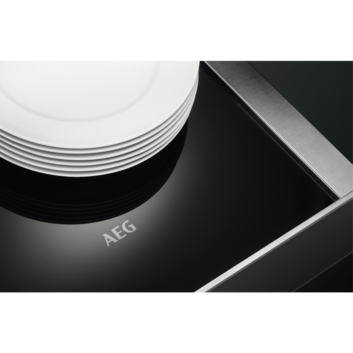 Close up of the interior of an AEG Warming Drawer with plates.