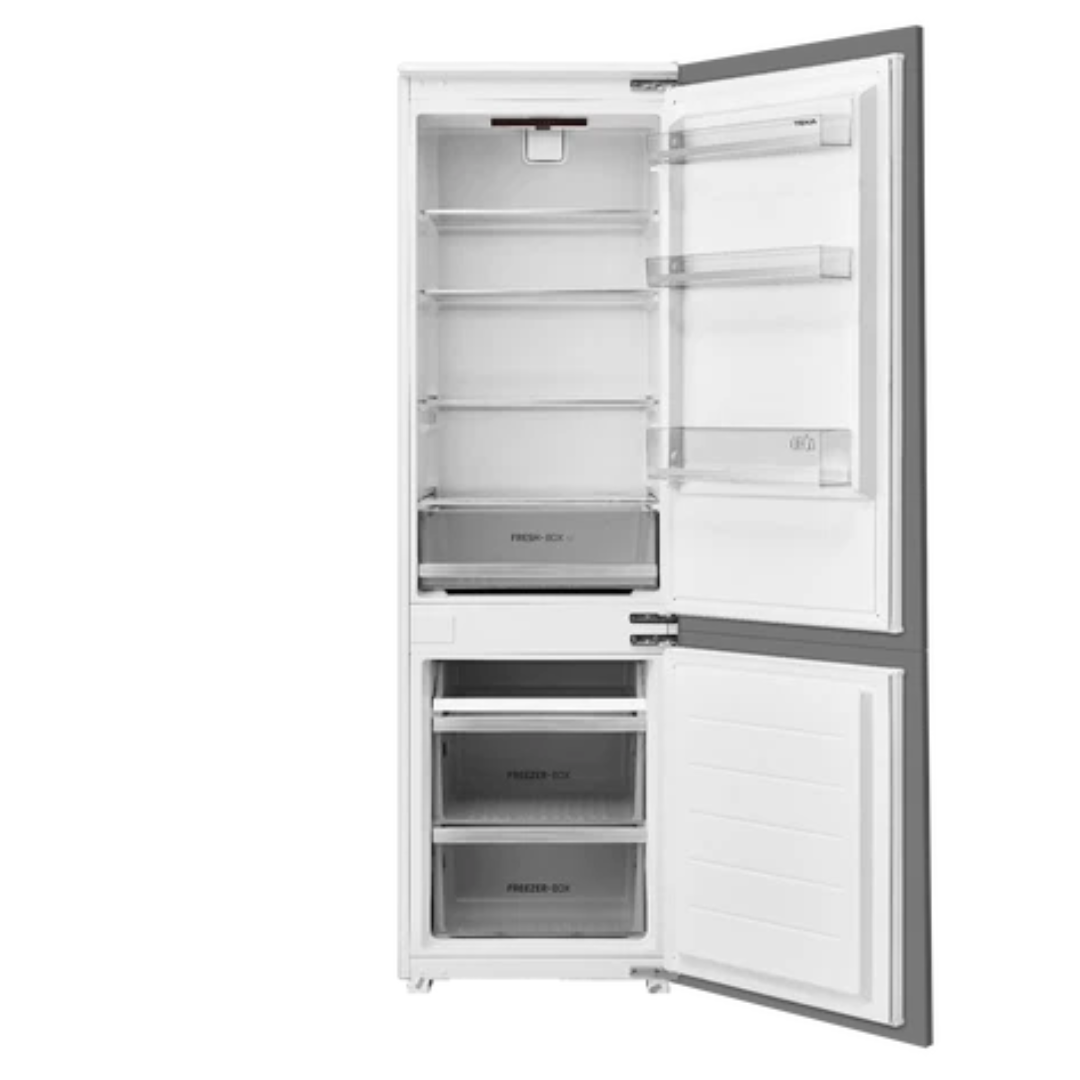 White TEKA refrigerator with open door on a white background