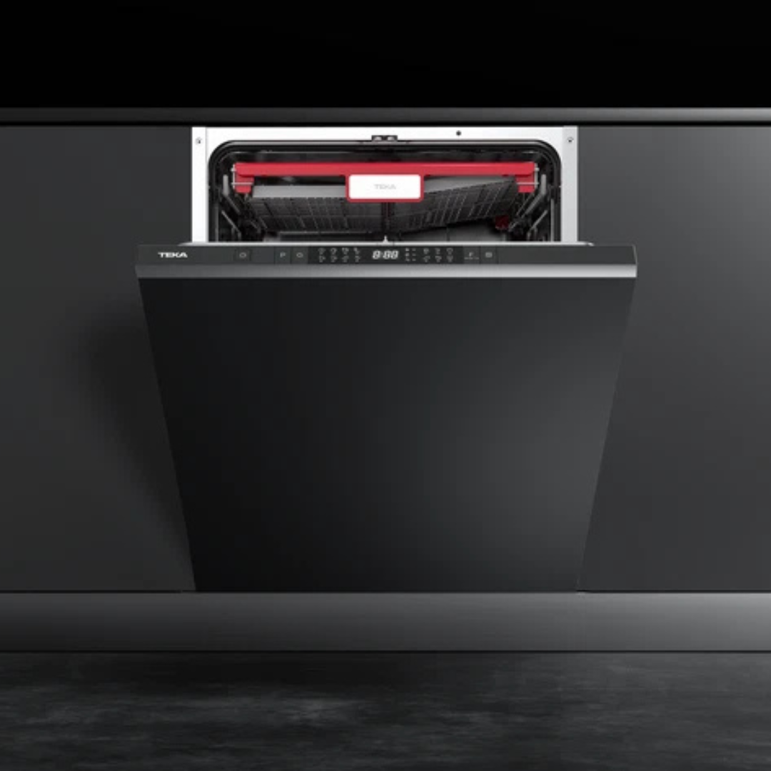 Black TEKA dishwasher with open door showing red interior on a dark background