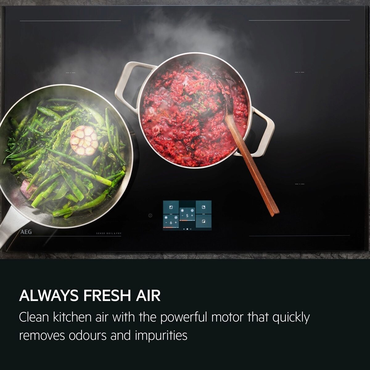 AEG Hob with two pots, one with green vegetables and the other with red food, on a black background.