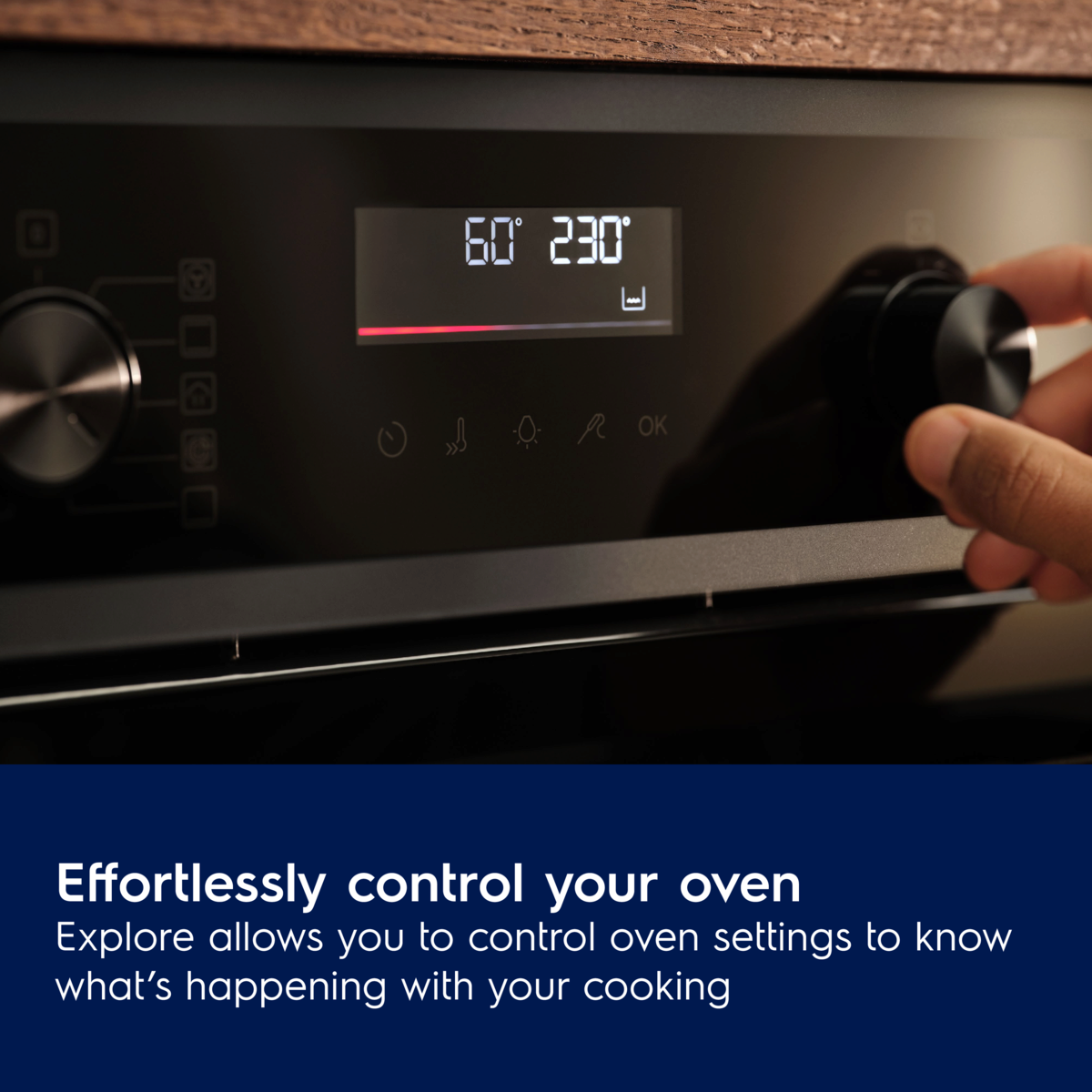 Hand adjusting settings on an Electrolux 500 Series SurroundCook® Multifunction Oven oven with digital display and text about controlling oven settings.