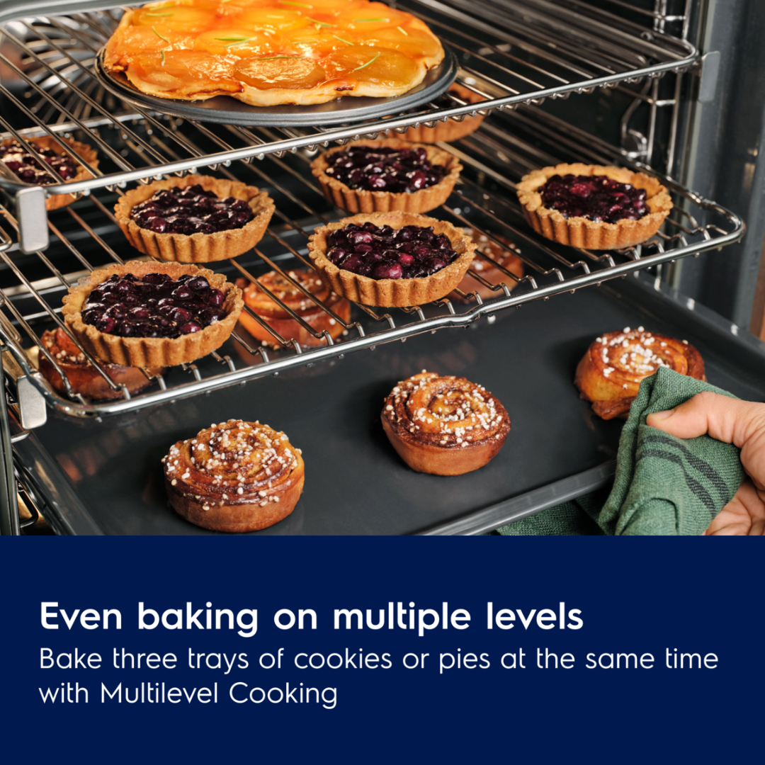 Electrolux Oven with multiple trays of baked goods including pies and cookies, with text highlighting multilevel cooking feature.