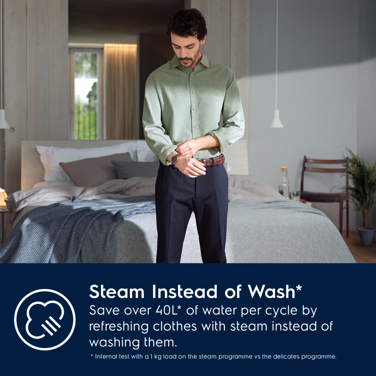 Man in a bedroom wearing a green shirt and dark pants, with a text overlay about Electrolux steam cleaning.