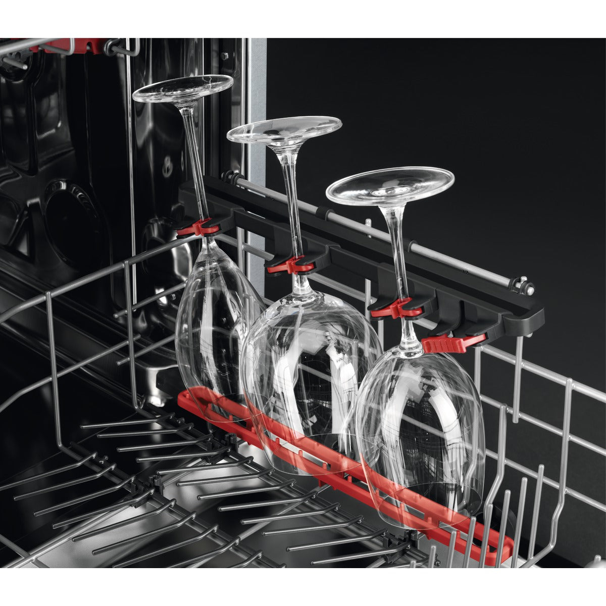 AEG Dishwasher with a red wine glass rack holding three wine glasses.