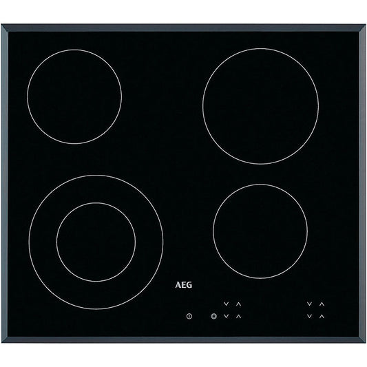 AEG electric hob with four heating zones on a black background