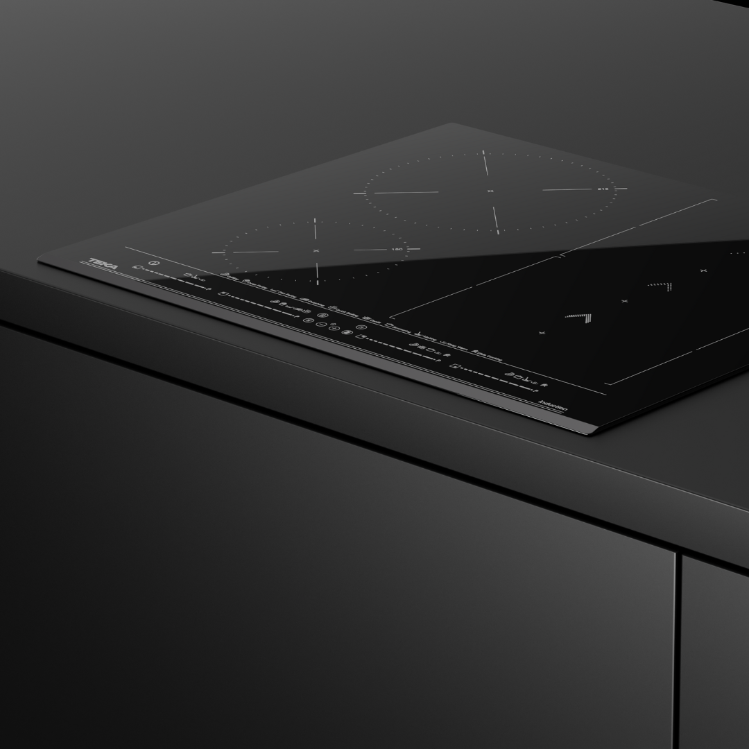 Black TEKA induction Hob on a dark gray countertop