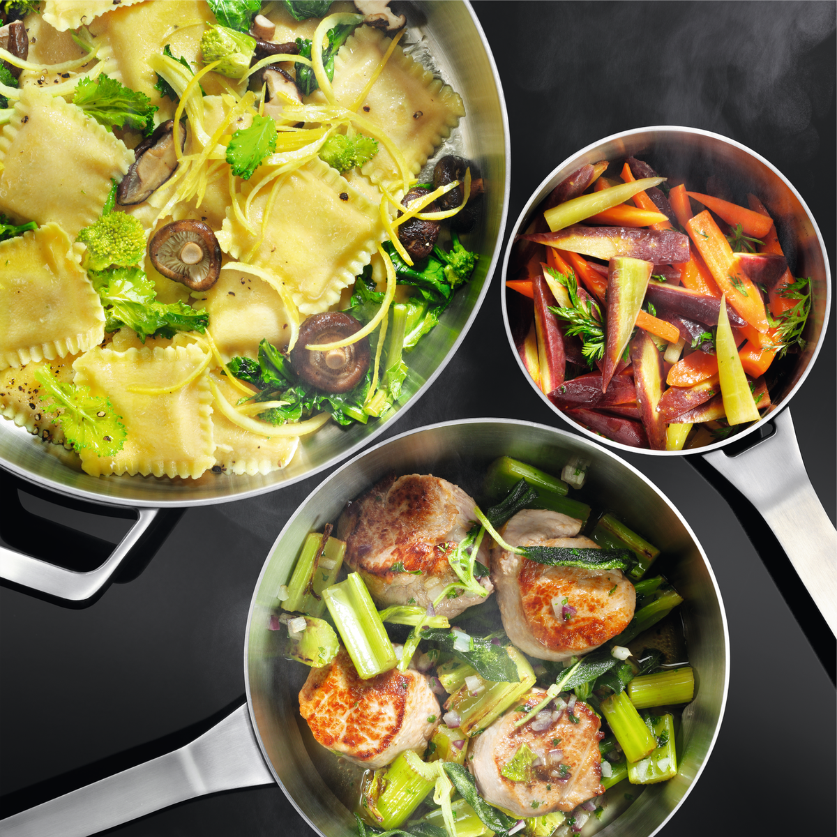 Three pans with different types of food on a stove