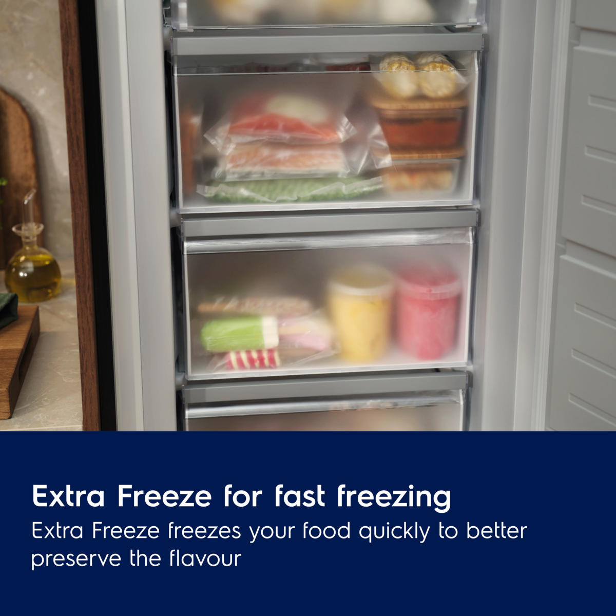 Electrolux Freezer with open drawers showing food items, emphasizing the 'Extra Freeze' feature.