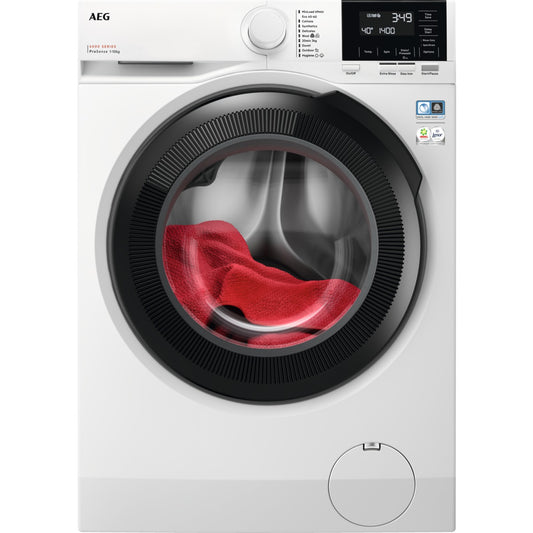 White AEG washing machine with a red towel inside on a white background