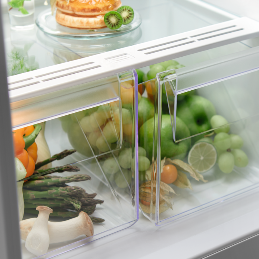 Electrolux Open refrigerator crisper drawer with fresh fruits and vegetables