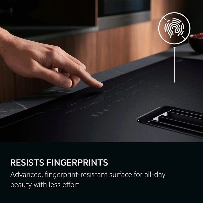 Person touching a fingerprint-resistant AEG SaphirMAtt Hob surface 