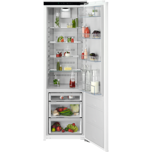 Open AEG refrigerator with various food items on a white background