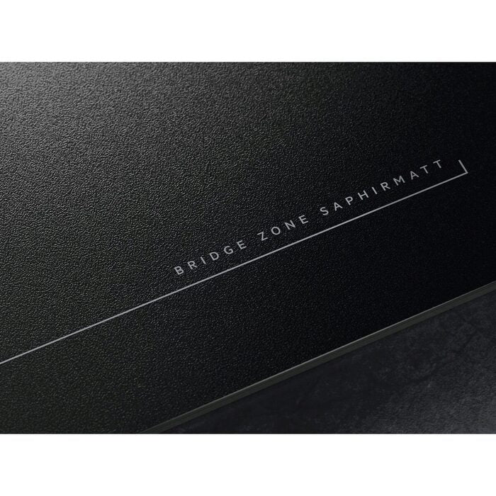Black AEG textured surface of Hob with 'BRIDGE ZONE SAPHIRMATT' text